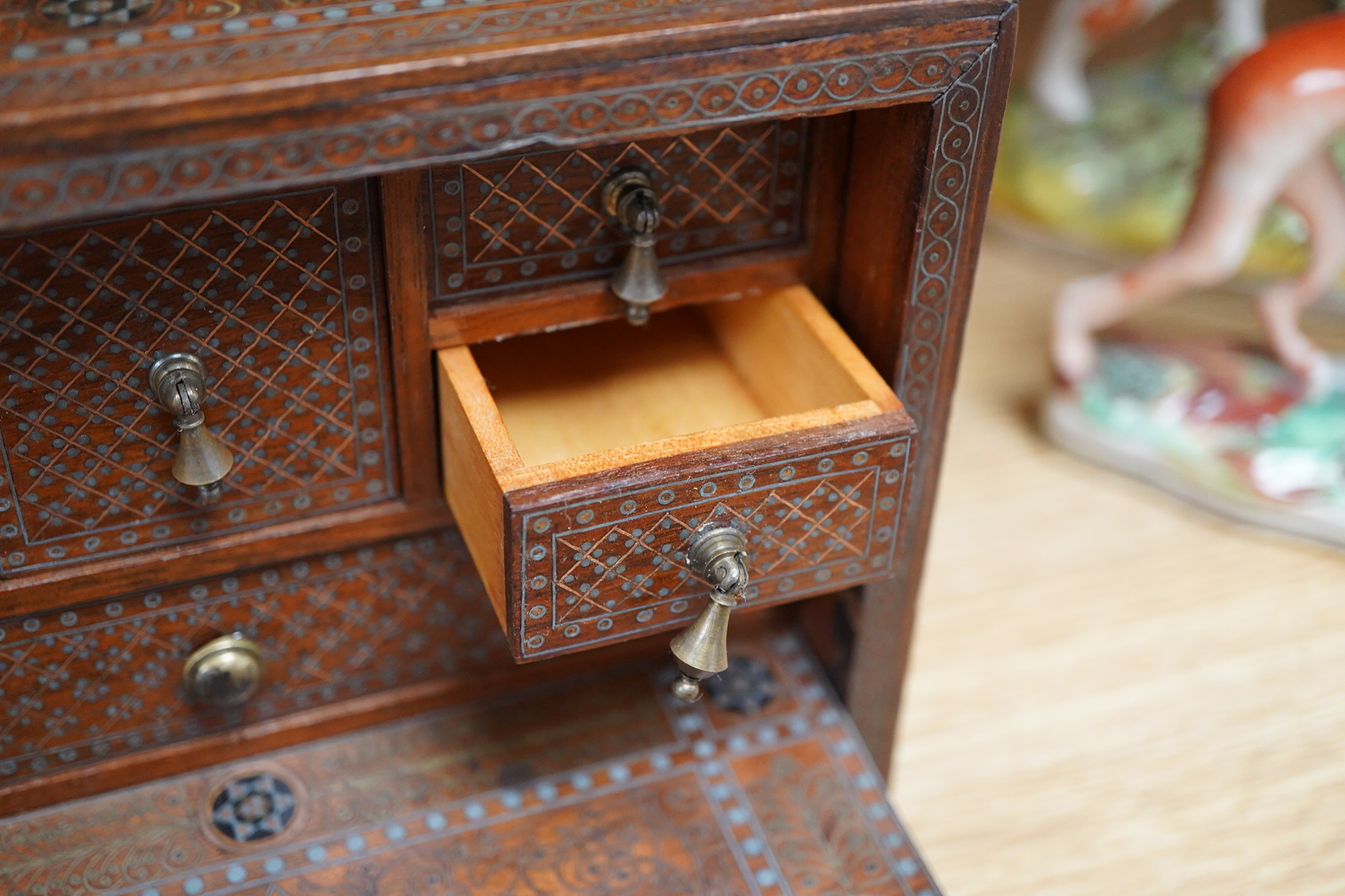A 19th/20th century Indian decorative metal inlaid table cabinet, with drawers, 19cm x 14.5cm high